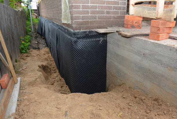 SJ Waterproofing Pros technician performing targeted Interior Drainage System assessment in Waverly, VA